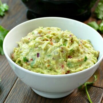 a white bowl of guacamole