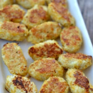 a white plate full of cauliflower tots