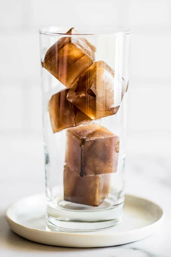 A glass Coffee flavored ice cubes