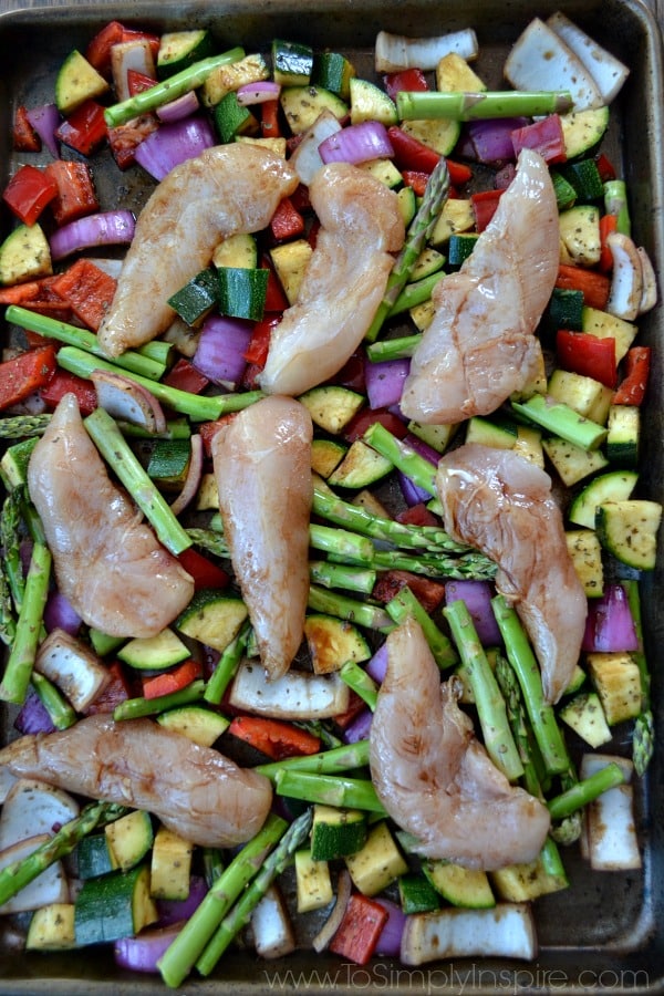 uncooked Chicken and Vegetables on a baking sheet