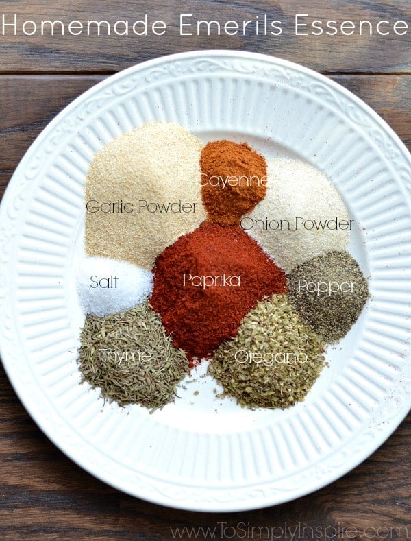 a white plate with piles of spices to make homemade emerils essence seasoning