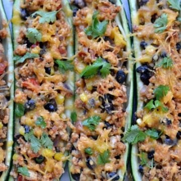 Closeup of Mexican Zucchini Boats with black beans and cilantro recipe in a casserole dish