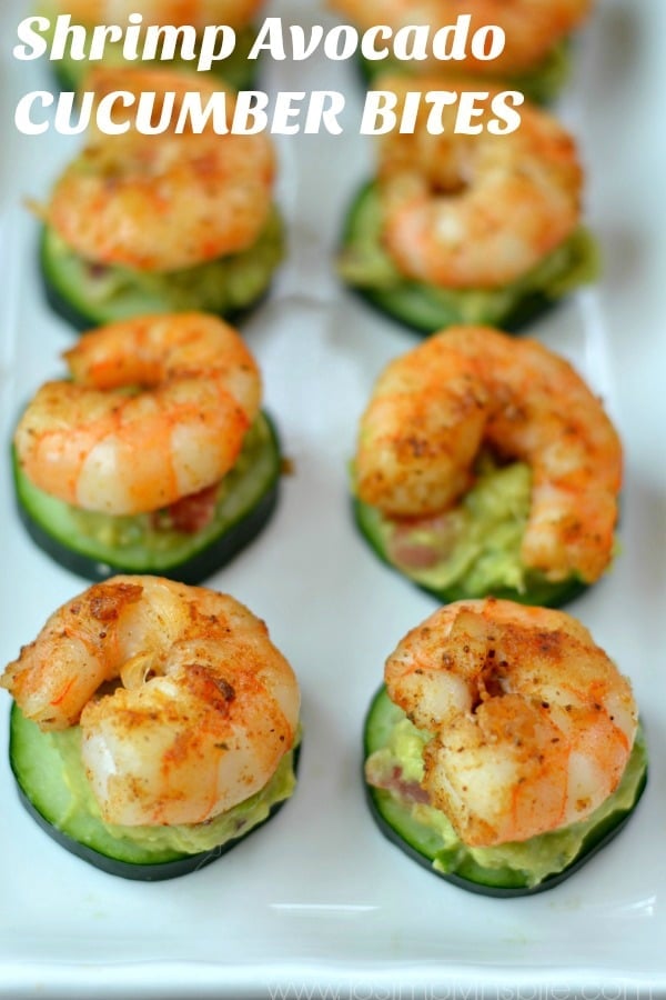 a group shrimp on top of cucumber slices