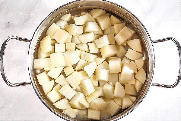 diced potatoes in a stainless steel pot