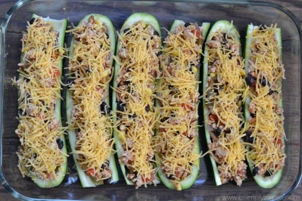 uncooked mexican zucchini boats in a casserole dish