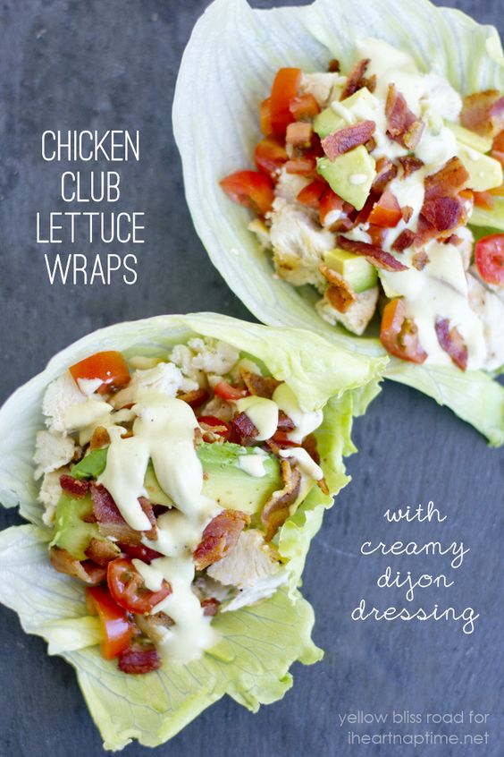 A piece of chicken club lettuce wraps with bacon and tomatoes 