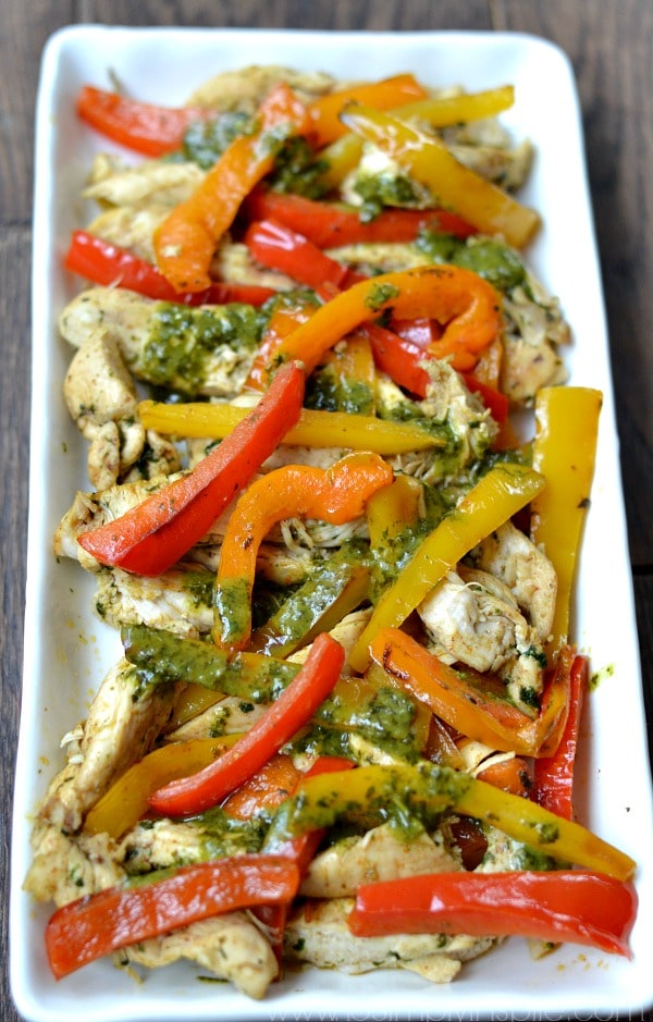 closeup of Cilantro Lime Chicken Fajitas recipe on a white rectangle plate.