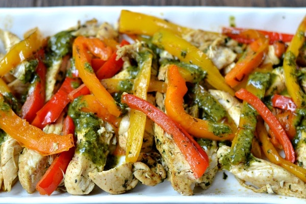 closeup of a plateful of Cilantro Lime Chicken Fajitas recipe with red and yellow bell peppers