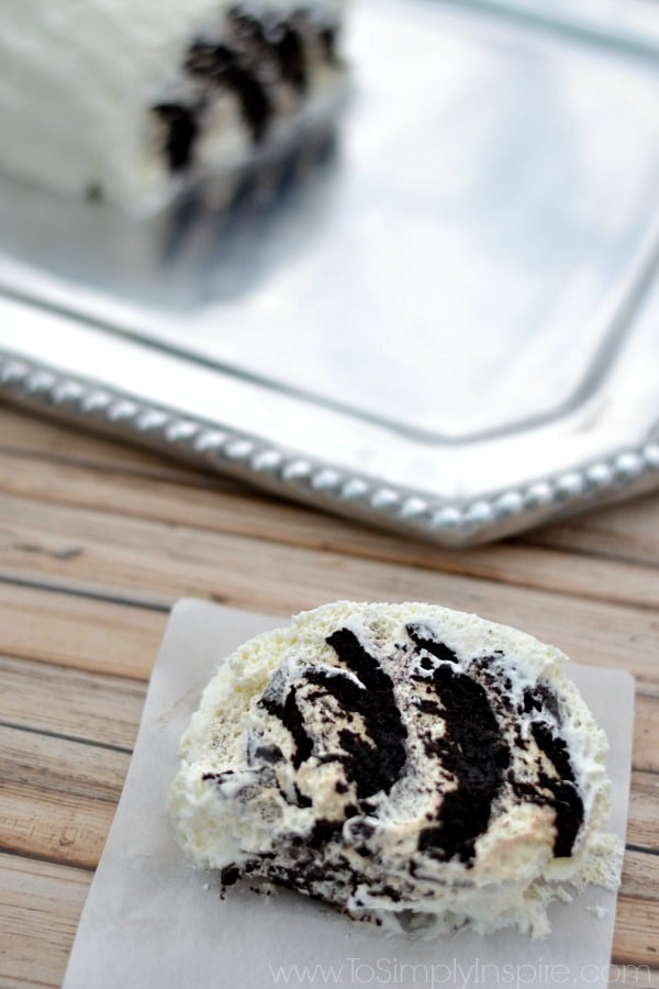 Closeup of a slice of Chocolate Wafer Cake with silver platter in the background 