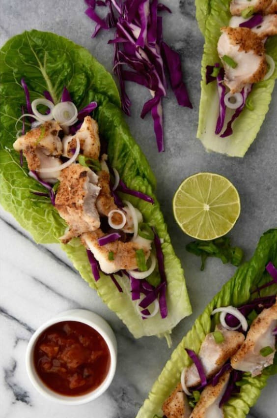 three Fish Taco Lettuce Wraps with a lime