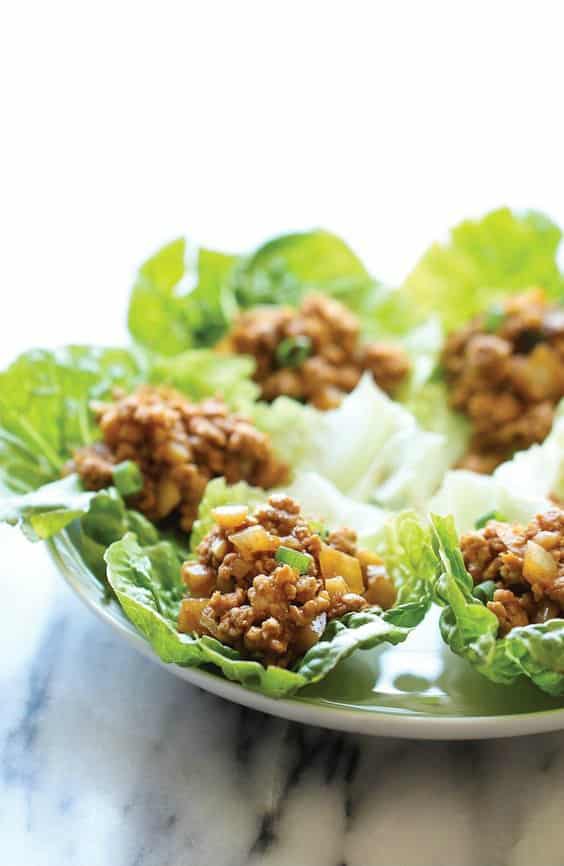 a plate of six PF Chang\'s Chicken Lettuce Wraps  
