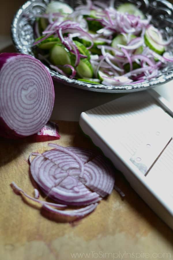 Sliced onion for Creamy Cucumber Salad 