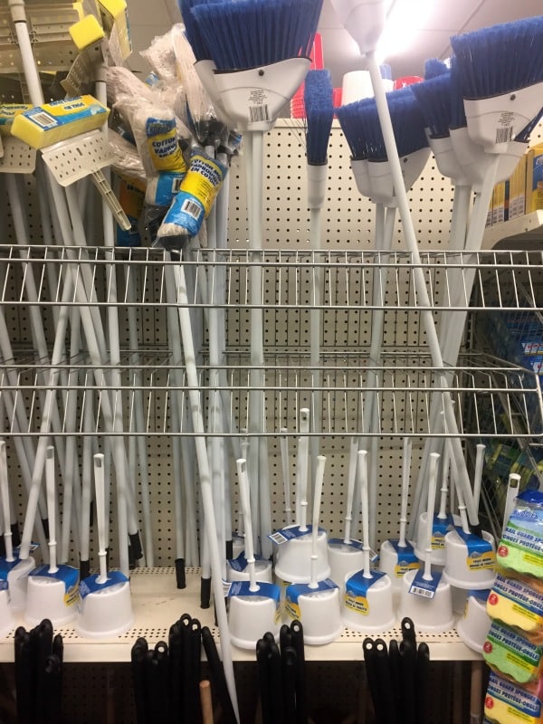 a store display of brooms