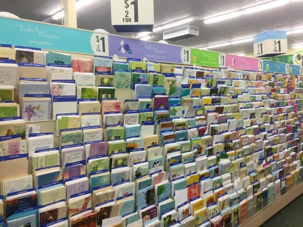 A store shelf filled with greeting cards