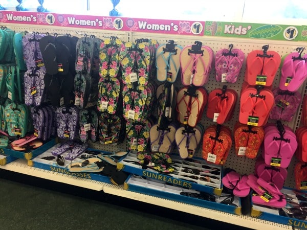 A store shelf display of flip flops