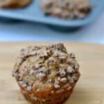 A muffin sitting on top of a wooden table