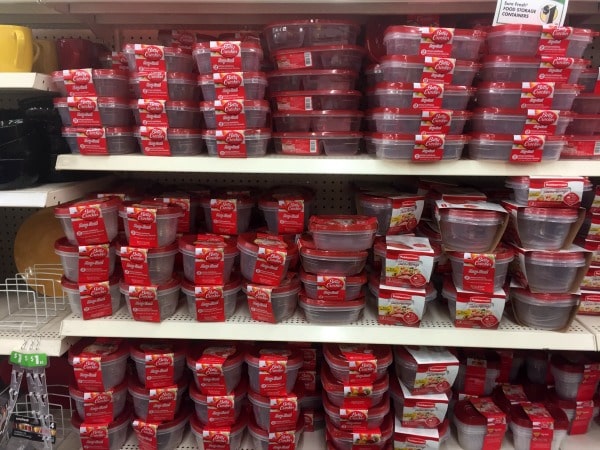 A store shelf filled with plastic storage containers