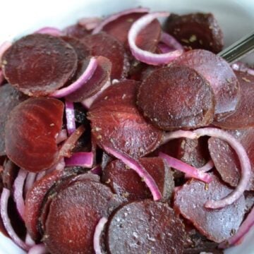 closeup of Roasted Beet Salad in a white bowl