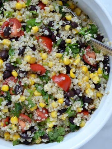 a closeup of Southwest quinoa salad recipe in a white bowl