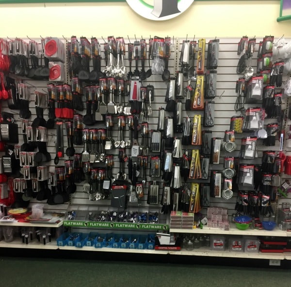 A store shelf filled with hair elastics and brushes