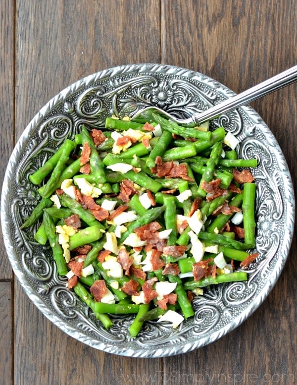 big silver bowl of Asparagus Bacon and Egg Salad and serving spoon