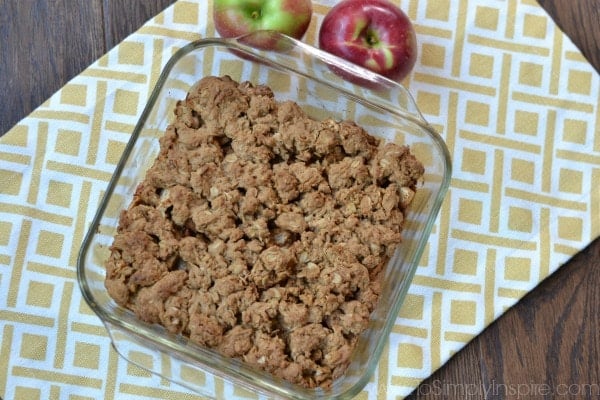 Apple Oatmeal Crumb Bars recipe in a square baking dish on a yellow and white placemat