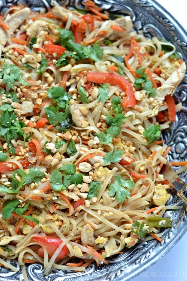 Closeup of Chicken Pad Thai recipe in a big silver bowl