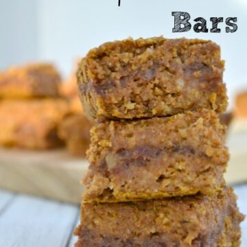 A close up of a stack of three pumpkin pecan bars