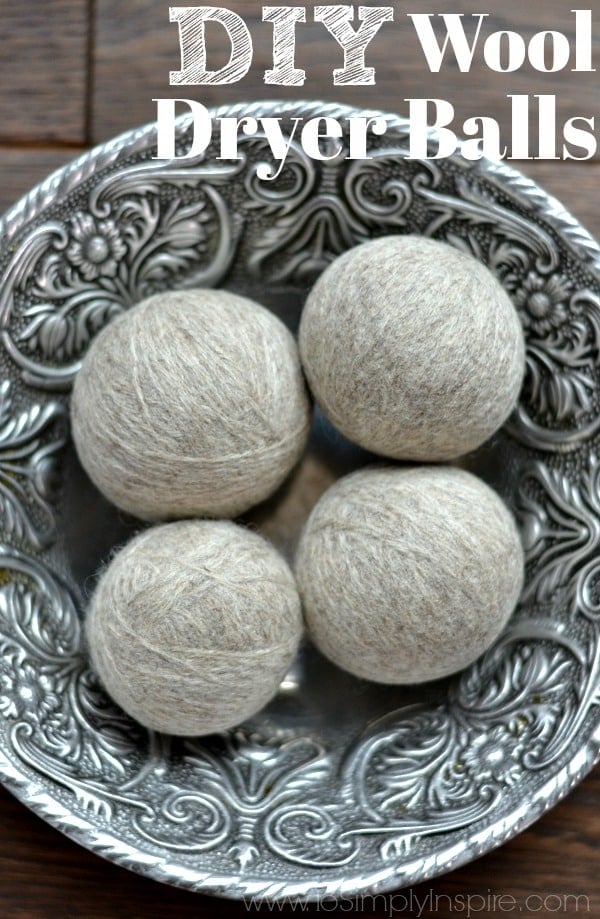 four DIY wool dryer balls in a silver bowl