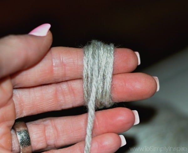wool yarn wrapped around 2 fingers