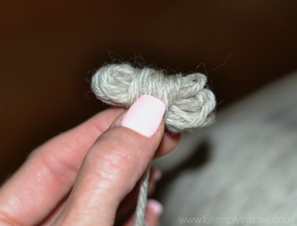 small wool yarn ball held in fingers
