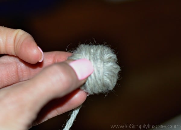 small ball of yarn held in fingers