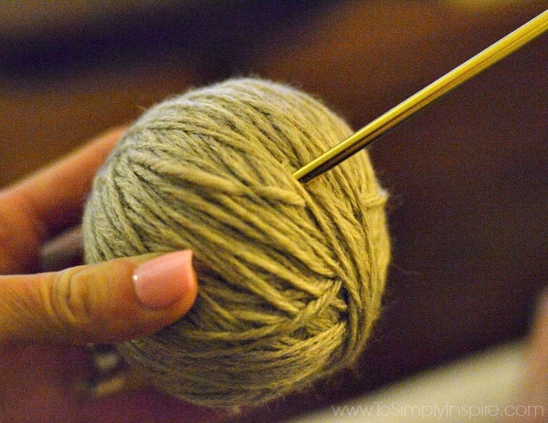 a ball of wool yarn held in a hand