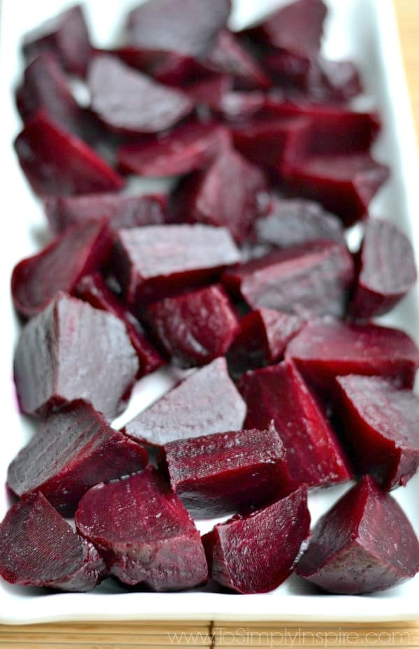 closeup of diced roasted beets on a white plate