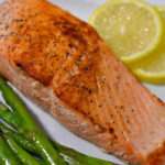 piece of salmon on a white plate