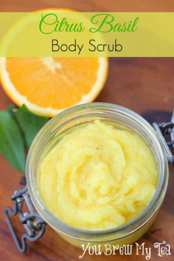 orange sugar scrub in a small mason jar with an orange slice