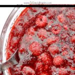 Raspberry Apple Jello Salad in a glass bowl with text overlay