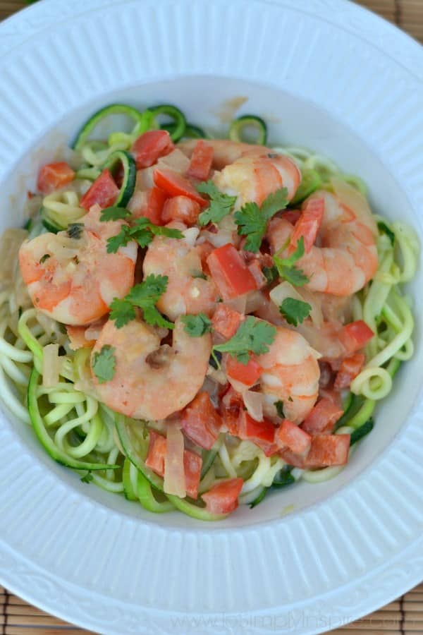 Shrimp Zoodles in Thai Coconut Sauce recipe in a white bowl on a bamboo placemat with text overlay