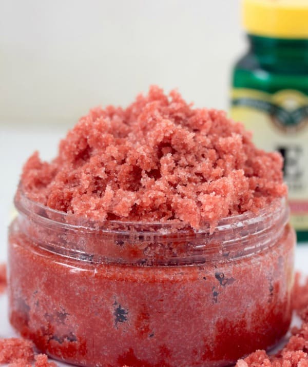 red sugar scrub in a small glass jar