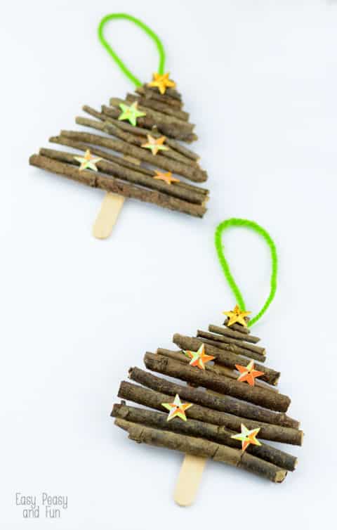 a closeup of a DIY craft sticks and twigs Christmas ornament