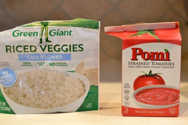 bag of green giant cauliflower rice and Pomi strained tomatoes on a counter