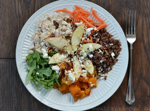 Quinoa Power Bowl withSweet potatoes, arugula, diced apple, red quinoa, feta, roasted pecans topped with honey dijon vinaigrette.