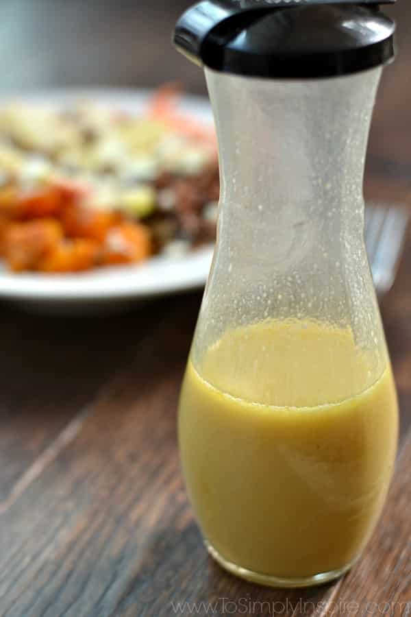 honey dijon vinaigrette in a carafe 