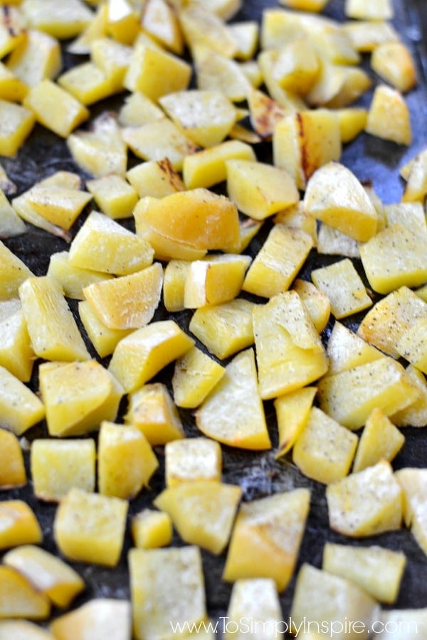 roasted turnips cubes on a baking sheet