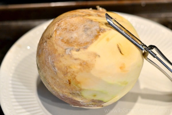 whole turnip being peeled