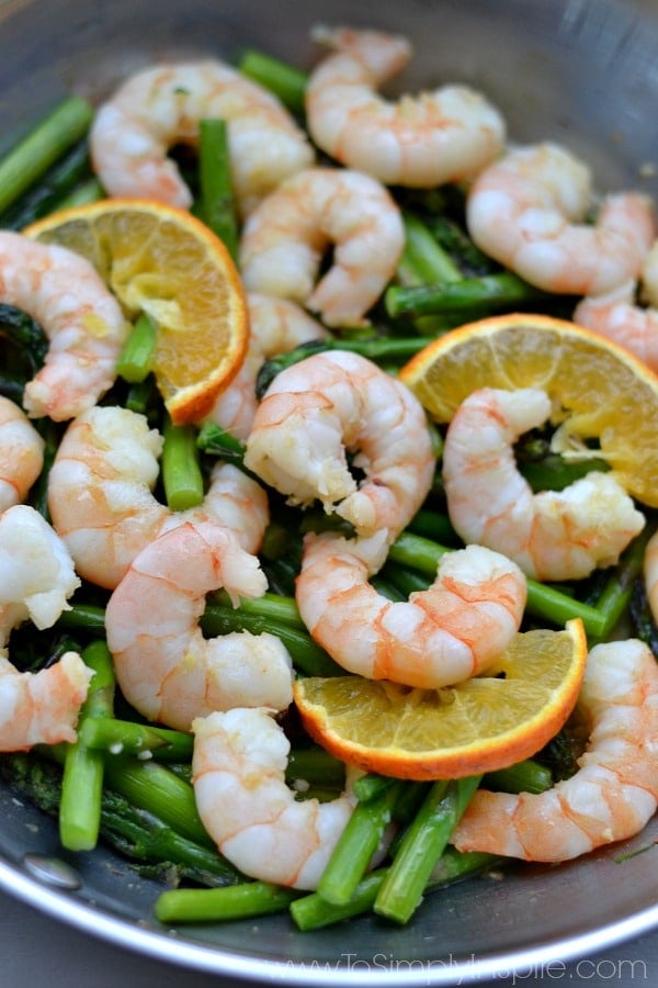Orange Garlic Shrimp with Asparagus Recipe in a silver bowl