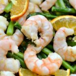 A pile of shrimp and asparagus