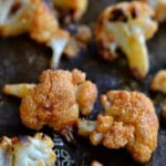 buffalo cauliflower on a baking sheet