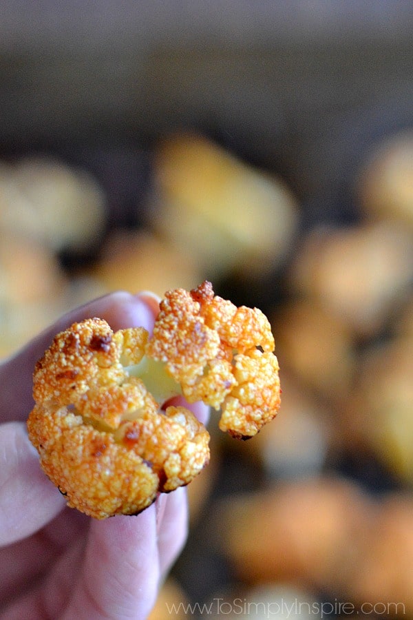 closeup of Buffalo Cauliflower held in fingers.