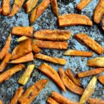 oven baked sweet potato fries on a baking sheet